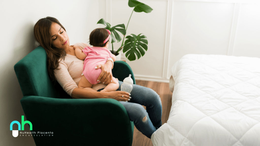 postpartum mother resting on couch while holding newborn baby during early recovery at home, illustrating postpartum healing and birth recovery support